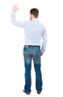 © ghoststone - Back view of beautiful business man welcomes. businessman in white shirt cheerfully waving his hand in greeting.