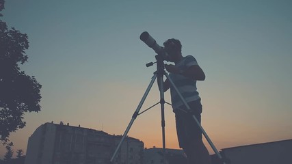 Wall Mural - stargazing through a telescope.