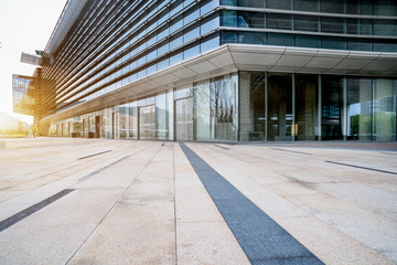 empty brick floor front of modern building