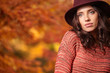 © ZoomTeam - Fashion woman on a background of red and yellow autumn leaves