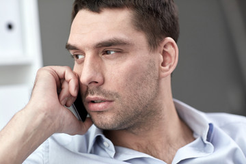 Sticker - face of young businessman calling on smartphone