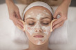 © Westend61 - Young woman in spa receiving facial mask