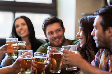 Poster - happy friends drinking beer at bar or pub