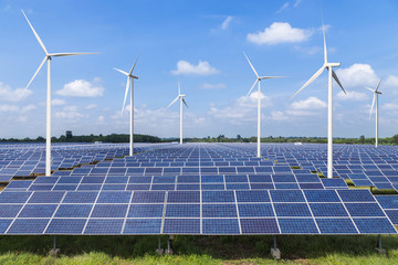 Wall Mural - solar photovoltaics panel and wind turbines generating electricity in solar power station