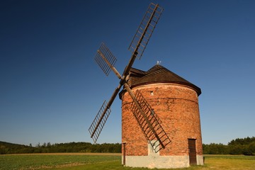 Beautiful old windmill and landscape with the sun. Chvalkovice - Czech Republic. Europe.