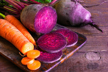 Fresh Beets And Carrots On Wooden Background