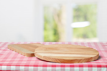 Wooden board with a napkin on a table