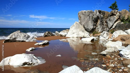 Stock Video of Lake Baikal Beach on a sunny windy day. Beautiful rocks