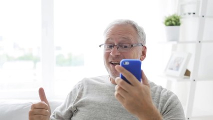 Sticker - senior man having video call on smartphone at home 124