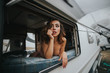 © ADDICTIVE STOCK - Portrait of young woman in underwear looking at window