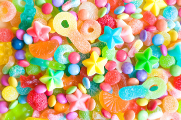 many colorful candies of different form