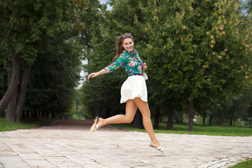 Poster - Young brunette woman in white skirt