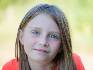 beautiful young girl outdoors, portrait children close up