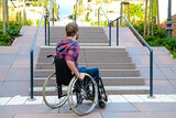 Fototapeta Mapy - disabled man in wheelchair in front of stairs