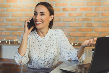 Wall Mural - Young woman relaxing in internet cafe