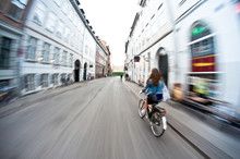 Girl On Bike Riding Fast - Motion Blur