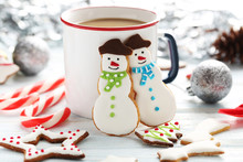 Christmas Cookies With Cup Of Hot Coffee On A Blue Wooden Table