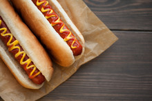 Barbecue Grilled Hot Dog With Yellow Mustard And Ketchup On Wooden Table. Fast Food.