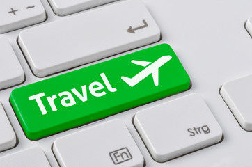 Wall Mural - a keyboard with a green button - travel