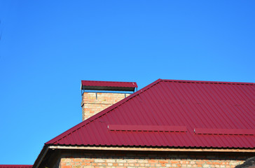 Wall Mural - New Metal Red House Roofing Construction.