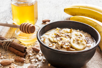 Wall Mural - oatmeal porridge in a bowl. healthy breakfast