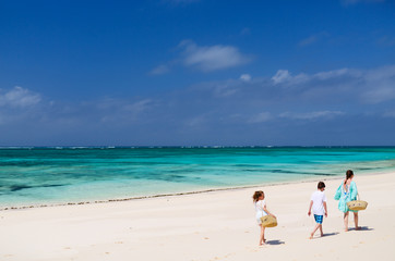 Wall Mural - mother and kids at tropical beach