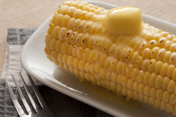 Cooked corn-cob with butter on top