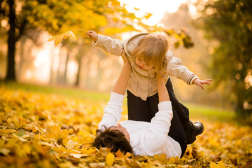 Wall Mural - Mother and child having fun