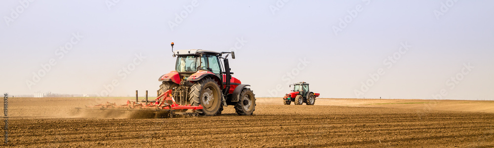 Farmer in tractor preparing land with seedbed cultivator - obrazy, fototapety, plakaty 