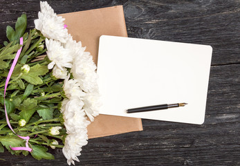 Wall Mural - Greeting card. Daisies with pen on empty sheet