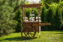 Decorative Wooden Cart In The Garden And Candy Bar