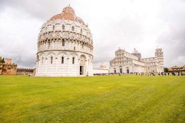 Canvas Print - Pisa cathedral with baptistery and leaning tower on the field of Miracles in Pisa town in Italy