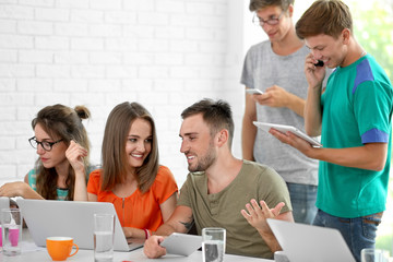 Canvas Print - Young people with gadgets hanging out together