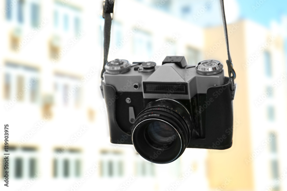 Vintage camera on blurred background