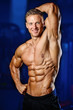 © antondotsenko - Strong athletic man fitness model showing six pack abs