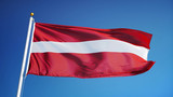 Fototapeta Boho - Latvia flag waving against clean blue sky, close up, isolated with clipping path mask alpha channel transparency