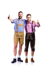 Wall Mural - Two hipster men in traditional bavarian clothes, studio shot