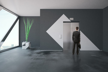 Wall Mural - Businessman in front of elevator