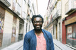 © santypan - Handsome young african man in the street.