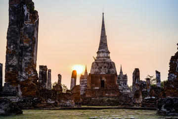 Ruins and pagoda ancient architecture of Wat Phra Si Sanphet old temple famous attractions during sunset at Phra Nakhon Si Ayutthaya Historical Park in Ayutthaya Province, Thailand