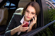 © antoshina_t - Woman sits in the car speaks by phone