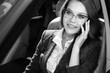 © antoshina_t - Woman sits in the car speaks by phone