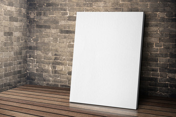 Leinwandbilder - Blank white canvas frame leaning at grunge brick wall and wood f