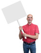 © spaxiax - smiling bald man holding a blank sign board.