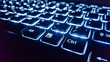 Neon keyboard with enter button. Focus on the  .