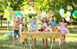 © Africa Studio - Children celebrating birthday in park