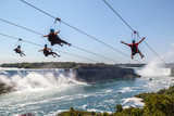 Four unrecognizable people
taking zipline ride at Niagara Falls, Ontario.
New zipline in Niagara Parks opened in the summer of 2016
