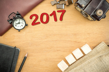 Poster - Wooden Table top with  clock,type box,notebook,leather bag and p