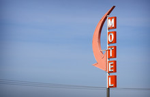Aged And Worn Vintage Neon Motel Sign With Arrow