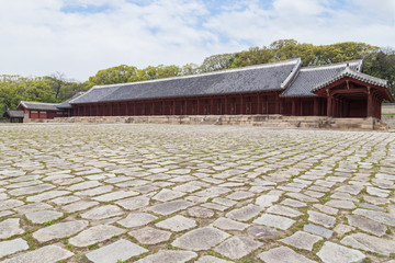 Plaza and Jeongjeon - the main hall of the Jongmyo Shrine in Seoul, South Korea. It is the oldest royal Confucian shrine preserved and UNESCO World Heritage Site.